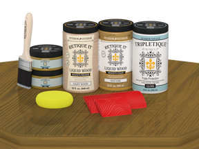 Retique It® Wood'n Cabinet Kit in Old Oak stain with gloss finish, featuring 12 grained cabinet doors on a table.