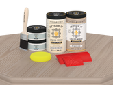 Retique It® Wood'n Cabinet Kit with 12 sun-bleached grained wood finish doors on a table surface.