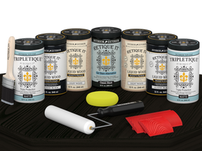 Retique It Wood'n Cabinet Kit with 24 black grained stained cabinet doors, matte finish on a wooden table.