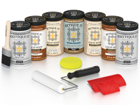 Retique It Cedar Wood'n Kit with Matte PolyTique It top coat, featuring Cedar Liquid Wood stain, Light Wood primer, Pecan Gel Stain Alternative, paint brush, white roller, yellow sponge, and red graining tools.