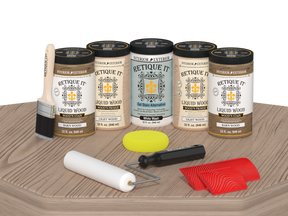 Retique It Wood'n Cabinet Kit French Oak stain on a cabinet door with grained wood texture and natural finish.
