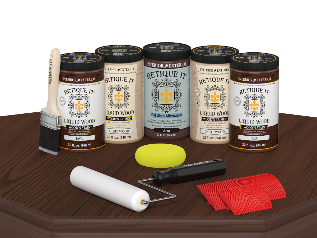 Retique It® Java Wood'n Kit featuring Java Liquid Wood stain, Light Wood primer, Java Gel Stain Alternative, paint brush, white roller, yellow sponge, and red graining tools displayed on a dark wood tabletop.
