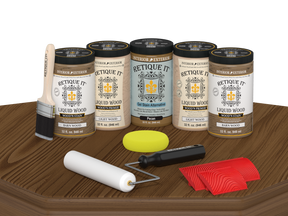 Retique It® Barn Wood Kit with primer, stains, brush, roller, yellow sponge, and red graining tools.