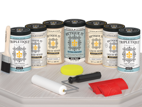 Retique It® Wood'n Cabinet Kit in White Wash stain with 24 grained cabinet doors, matte finish, shown on a table.