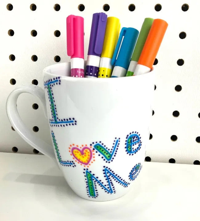 DecoArt glass paint marker set with six colorful markers for decorating glass surfaces and crafts.