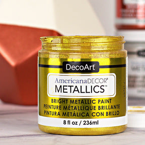 DecoArt Americana Decor Metallics pearl finish in an 8 oz bottle, showcasing shiny, metallic paint ideal for craft and home decor projects.
