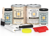 Retique It wood care products including cans, a brush, and applicators on a white background