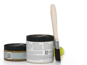 Jar of wood finish product with a brush on a white background