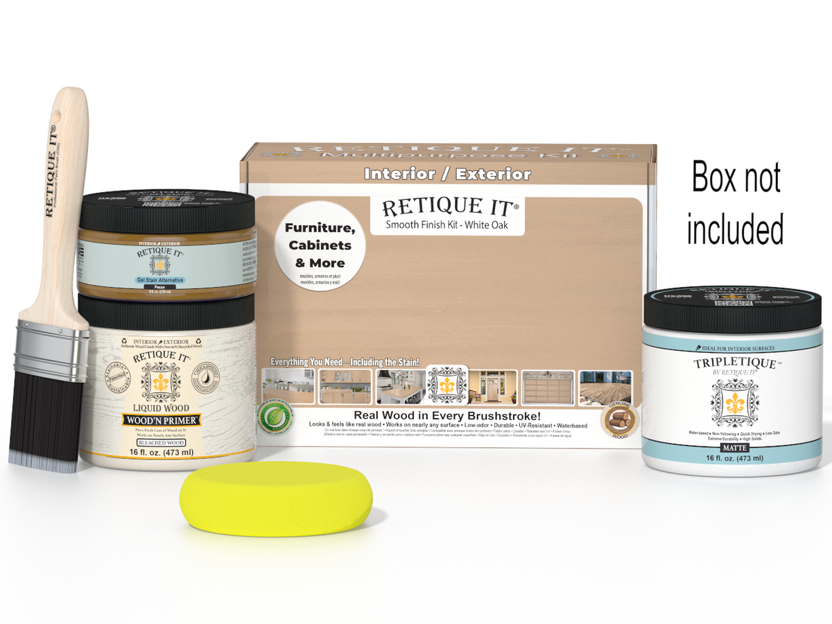 Painting kit with jars, brush, and sponge on a white background