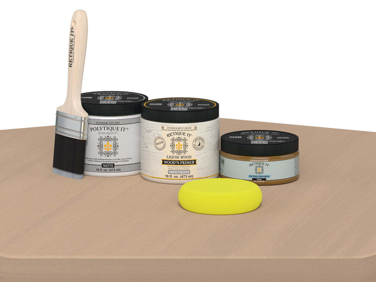 Painting supplies including a brush, cans of paint, and a sponge on a beige surface.