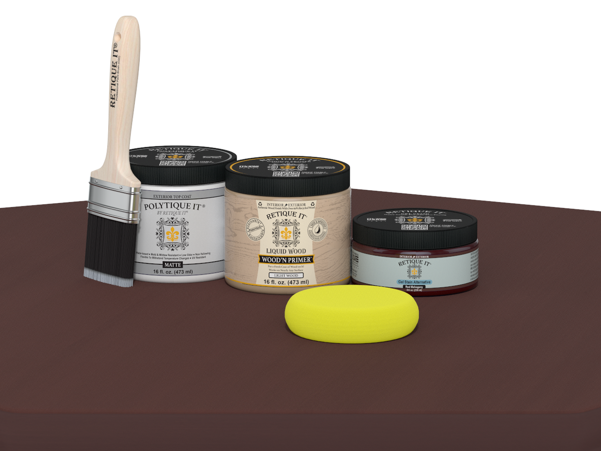 Collection of paint-related products including a brush, jars, and a sponge on a brown surface.
