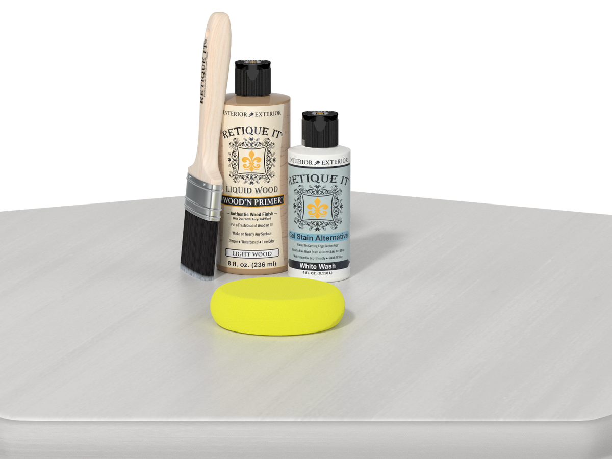 Set of paint-related products including a brush, bottles, and a sponge on a white surface.