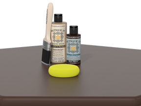 Set of Etiquette Wood Care products including a brush, bottle, and sponge on a gray surface.