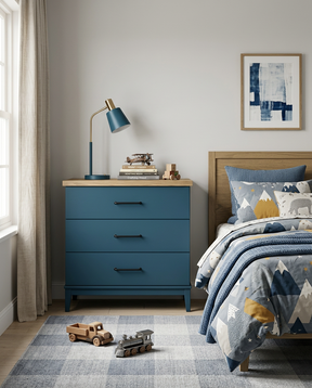 Children's bedroom with blue dresser, bed with mountain-themed bedding, and toys on checkered rug.
